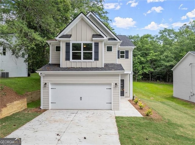 view of front of home featuring a garage, central AC unit, and a front lawn