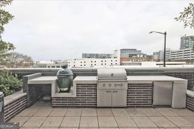 view of patio featuring an outdoor kitchen