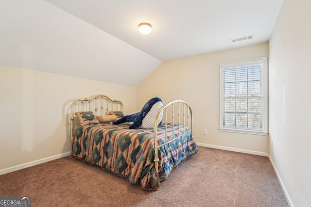 carpeted bedroom featuring visible vents, vaulted ceiling, and baseboards