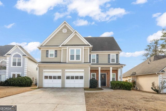 view of front of property with a garage and covered porch