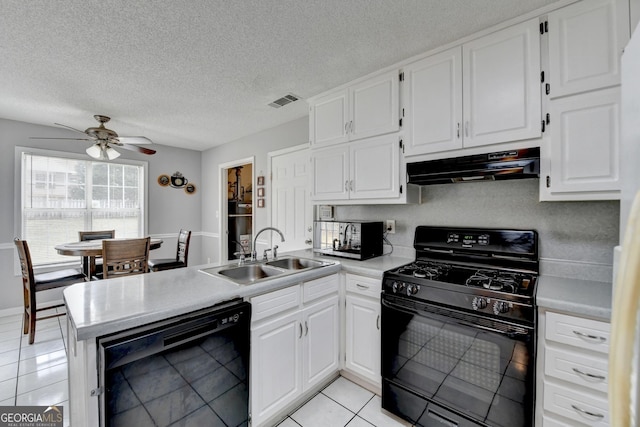 kitchen featuring sink, light tile patterned floors, black appliances, and white cabinets