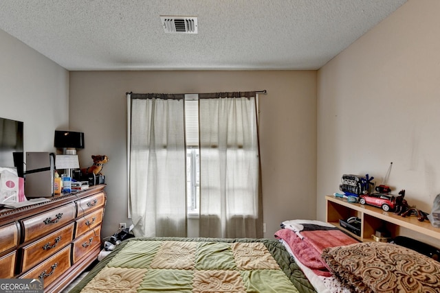 bedroom featuring a textured ceiling