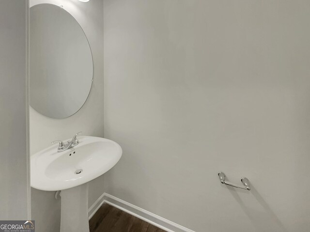 bathroom with wood-type flooring