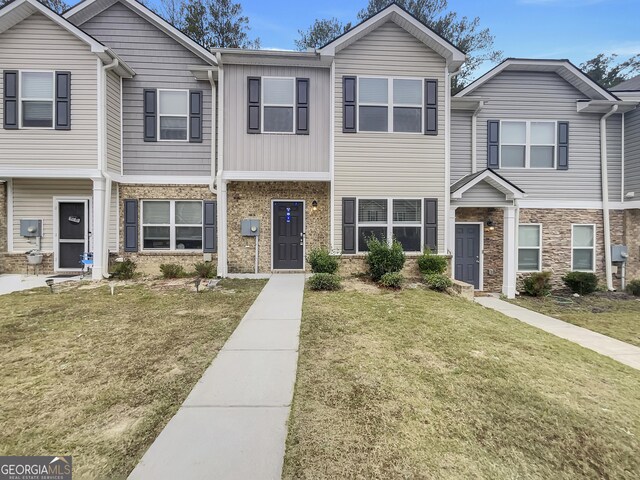 view of property with a front lawn