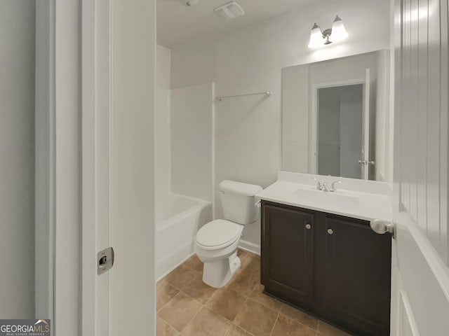 bathroom featuring tile patterned floors, vanity, and toilet