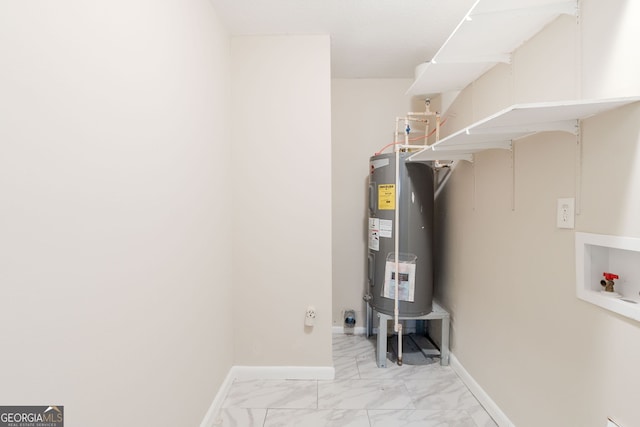 utility room featuring electric water heater