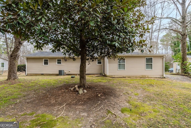 back of property featuring central AC unit