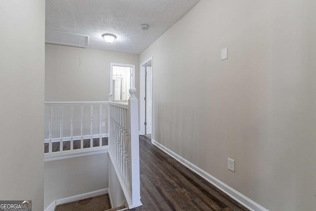 hallway featuring a textured ceiling