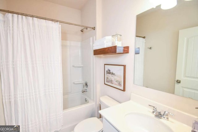 full bathroom featuring vanity, shower / bathtub combination with curtain, and toilet