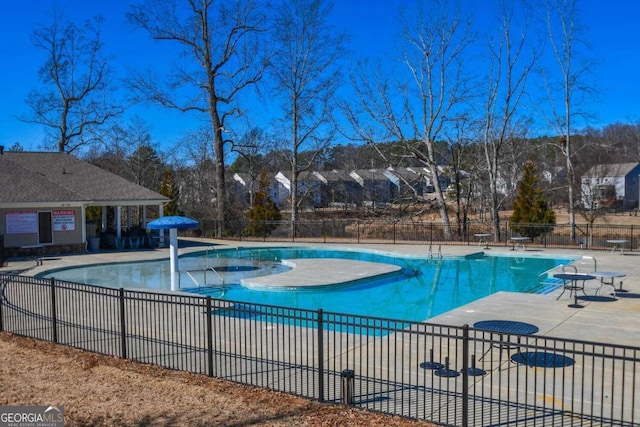 view of swimming pool with a patio