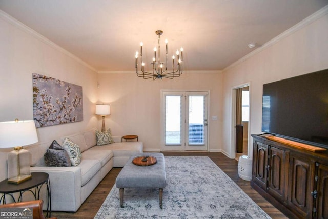 living room featuring crown molding, dark wood-type flooring, and a chandelier