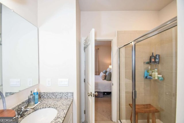 bathroom featuring an enclosed shower and vanity