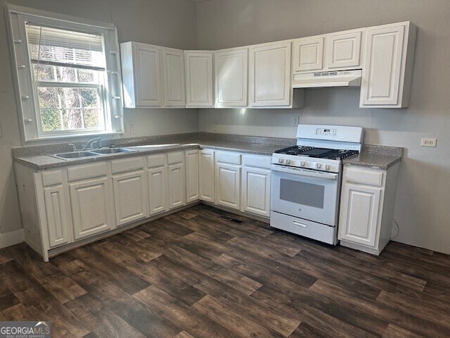 kitchen with white cabinetry, white gas range, dark hardwood / wood-style flooring, and sink