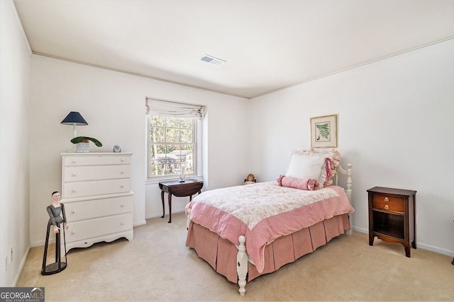 bedroom featuring ornamental molding, visible vents, light carpet, and baseboards