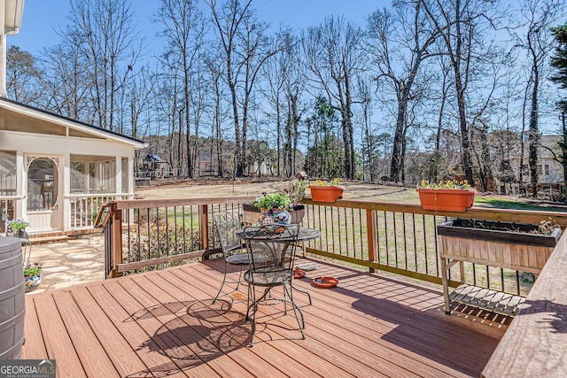 wooden terrace with a sunroom