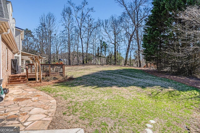 view of yard featuring a deck