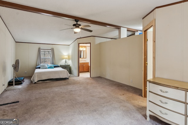 unfurnished bedroom featuring connected bathroom, vaulted ceiling with beams, light colored carpet, and ceiling fan