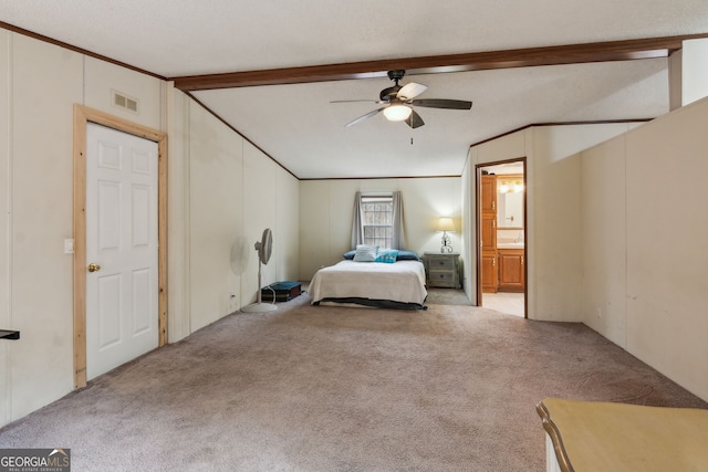 unfurnished bedroom with light carpet, vaulted ceiling with beams, ensuite bath, and ceiling fan