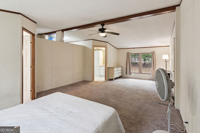 carpeted bedroom with ceiling fan, ensuite bathroom, a textured ceiling, and vaulted ceiling with beams