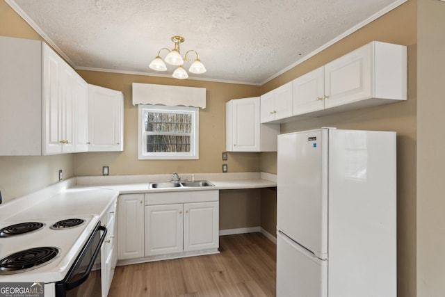 kitchen featuring range with electric stovetop, white cabinetry, white fridge, and sink