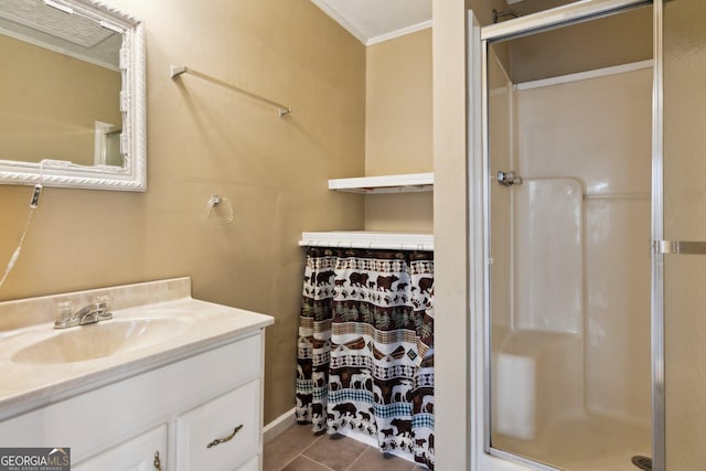 bathroom with walk in shower, tile patterned floors, ornamental molding, and vanity