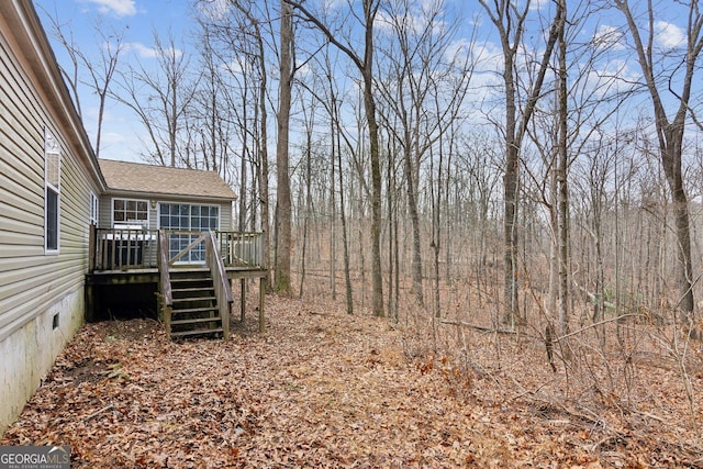 view of yard featuring a wooden deck