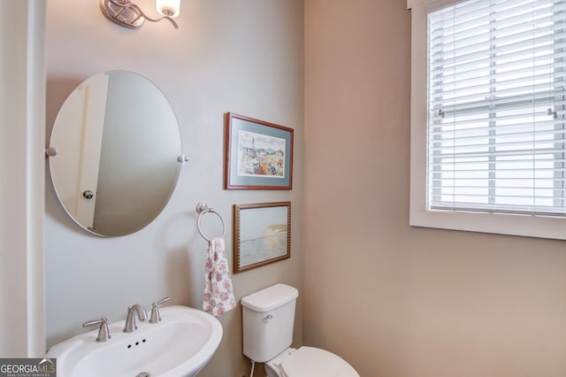 bathroom featuring sink and toilet