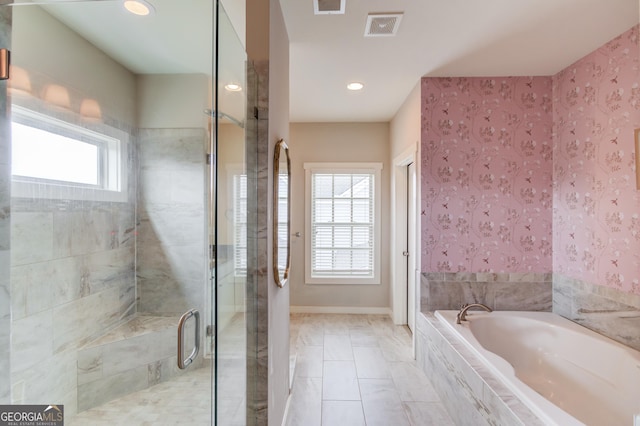 bathroom featuring plus walk in shower