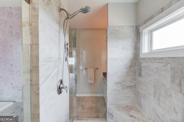 bathroom featuring a shower with door