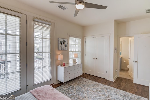 bedroom featuring a closet, dark hardwood / wood-style floors, and ceiling fan