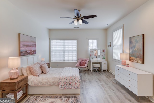 bedroom featuring light hardwood / wood-style flooring and ceiling fan