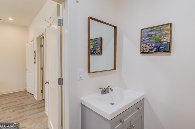 bathroom with vanity and wood-type flooring