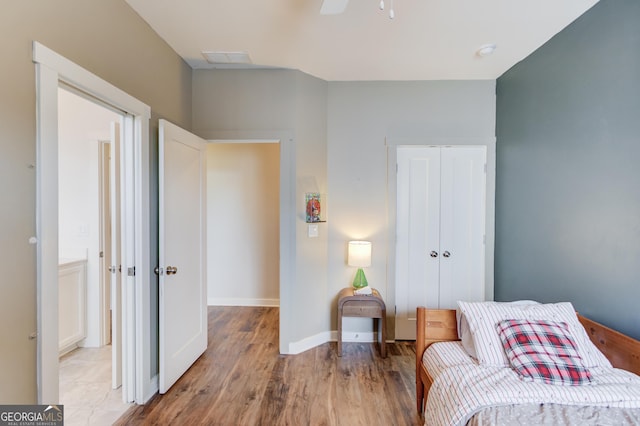 sitting room featuring ceiling fan and hardwood / wood-style floors