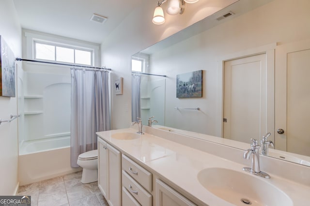 full bathroom with vanity, shower / tub combo, tile patterned floors, and toilet