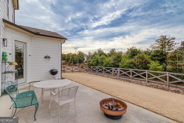 view of patio with an outdoor fire pit