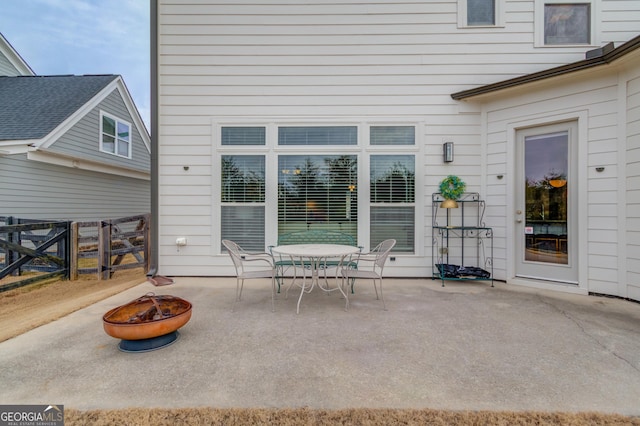 view of patio / terrace with an outdoor fire pit