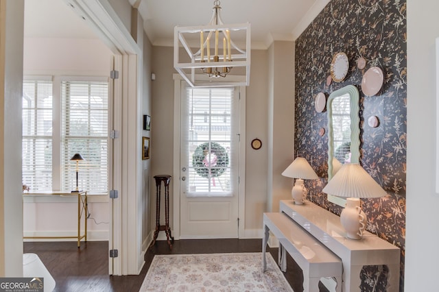 entryway with hardwood / wood-style flooring, ornamental molding, and plenty of natural light