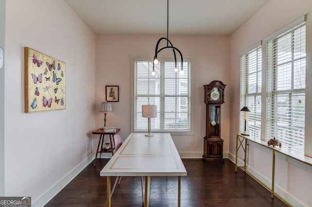 dining space with dark wood-type flooring and plenty of natural light