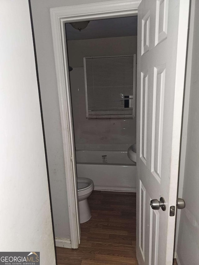 bathroom featuring toilet and hardwood / wood-style floors