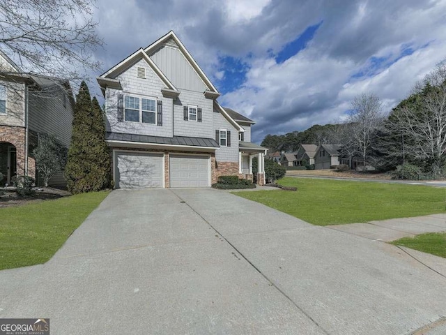 view of front of house featuring a garage and a front lawn