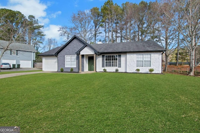 ranch-style house with a garage and a front yard