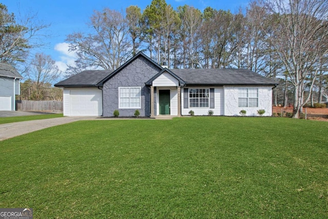 single story home featuring a garage and a front yard