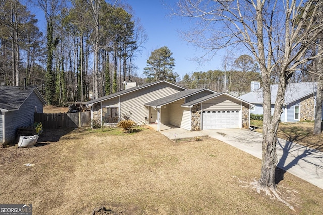 ranch-style house with a front yard and a garage