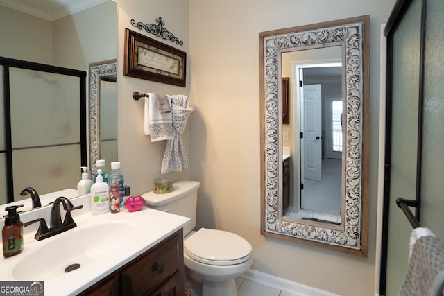 bathroom with vanity, crown molding, and toilet