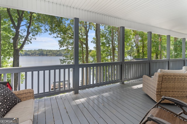 wooden terrace with a water view