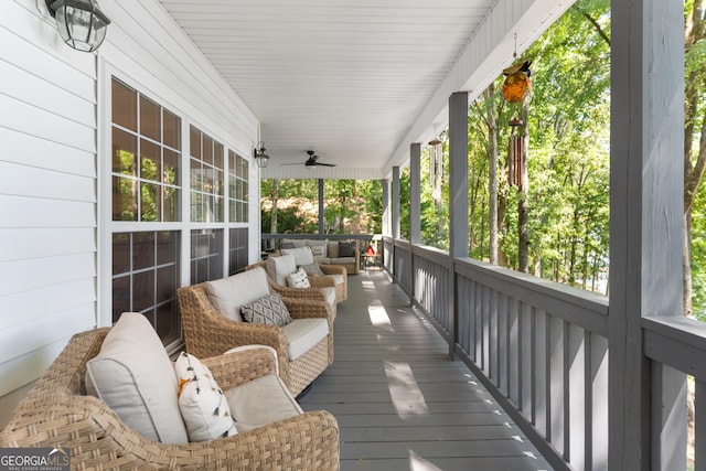 wooden deck featuring ceiling fan and a porch