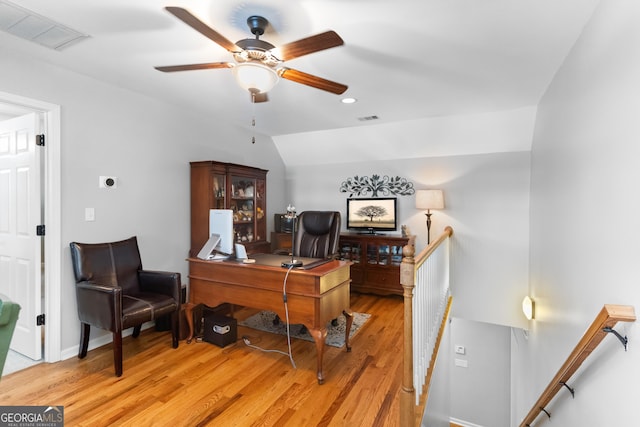 office featuring lofted ceiling and light wood-type flooring