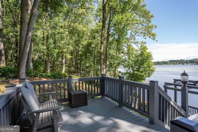 deck featuring a water view