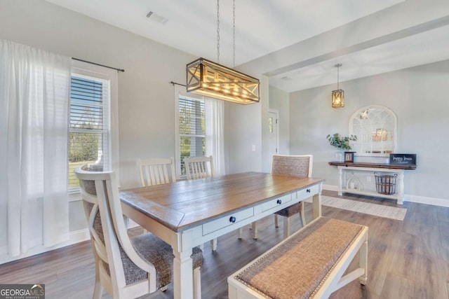 dining room with dark hardwood / wood-style floors