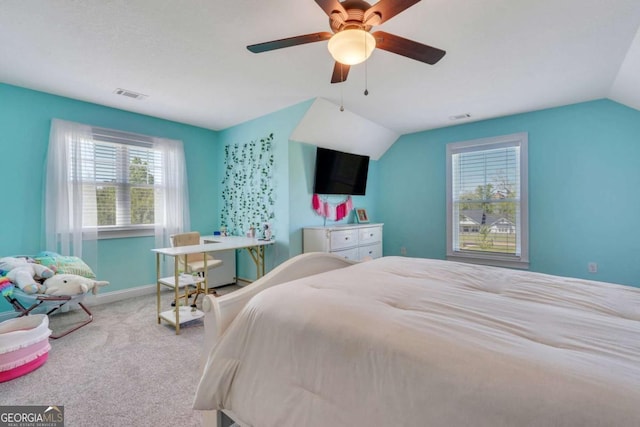 bedroom with carpet floors, ceiling fan, and vaulted ceiling